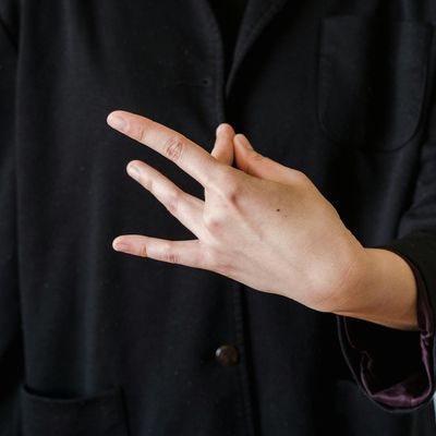 Close-up of hands in a meditative mudra position.